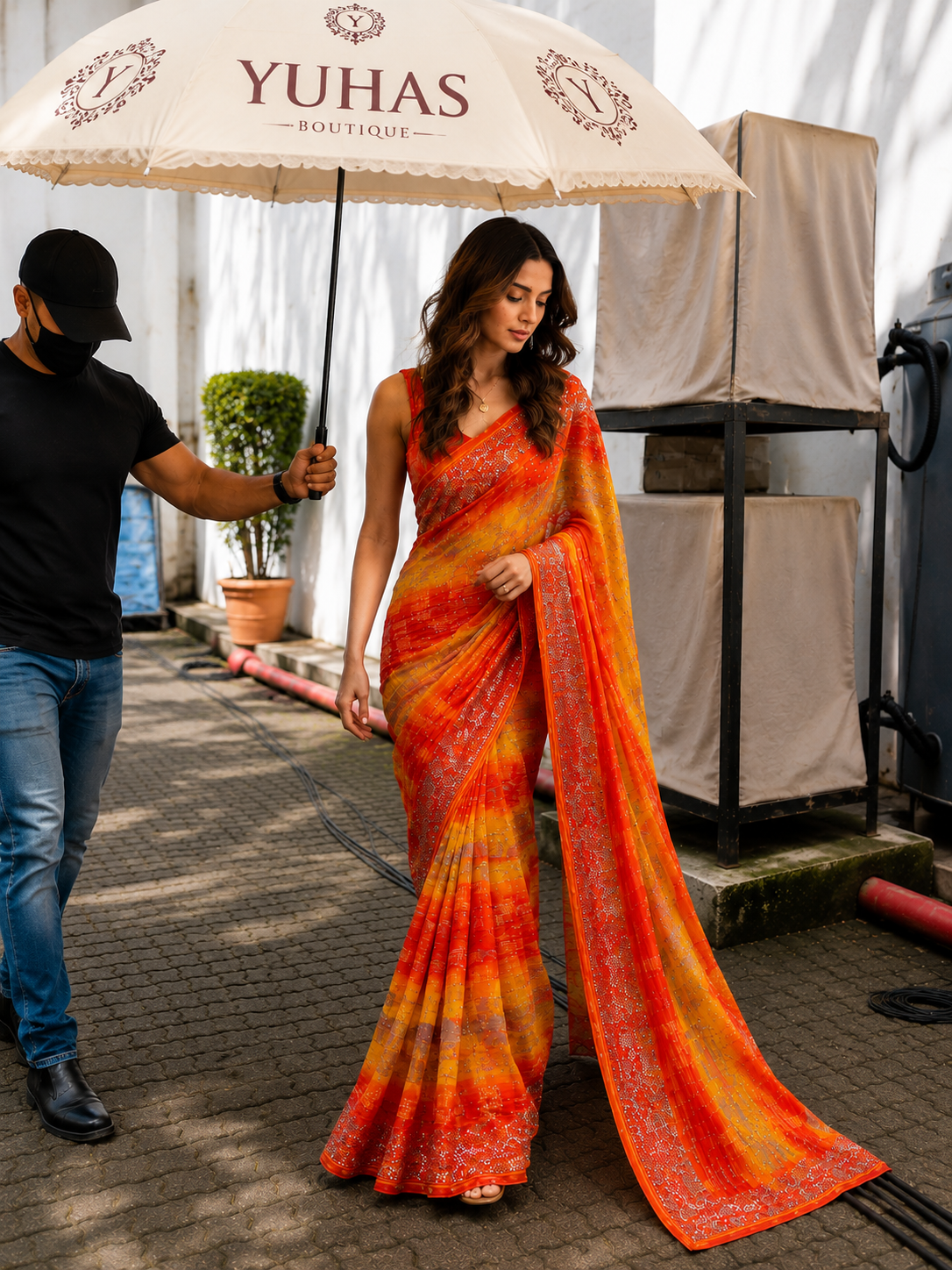 Yellow and Golden Orange Trisha designer saree in with rhinestone and tinsel work